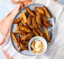 Air-fryer potato wedges with mayonnaise alongside