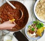 Burnt aubergine veggie chilli in a large pot with rice