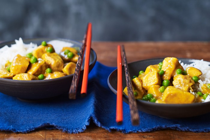 Two bowls of Chinese chicken curry with chopsticks