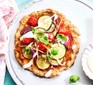 One courgette & lemon pizzette on a plate