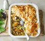 Creamy leek, pesto & squash pie in a serving dish