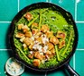 Crispy gnocchi in a frying pan with cavolo nero pesto, asparagus & peas