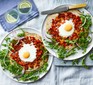 Egg & rocket pizzas on plates