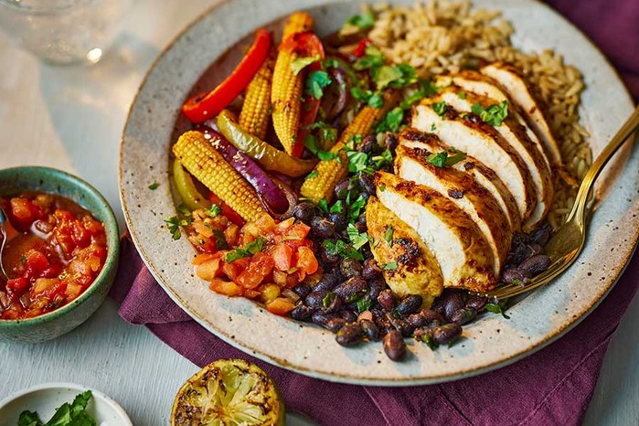 One fajita chicken rice bowl with burnt lime