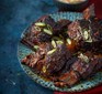 Slow-cooker gochujang short ribs with apple slaw served on a plate