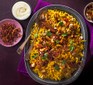 A sharing plate serving golden spiced pilaf with crispy shallots