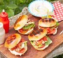 Halloumi burgers served on a wooden serving board