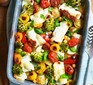 Halloumi traybake served in a casserole dish