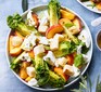 Peach panzanella salad served in a bowl