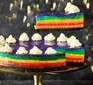 Rainbow cheesecake with slice cut