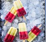 Rainbow fruit lollies on ice cubes