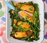 Salmon in tray with greens