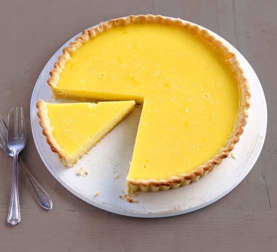 Lemon tart with slice taken out