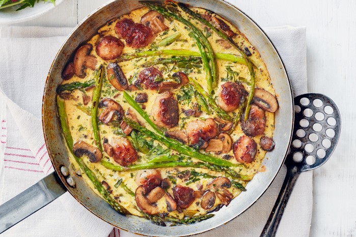 Tarragon, sausage and mushroom frittata in a pan